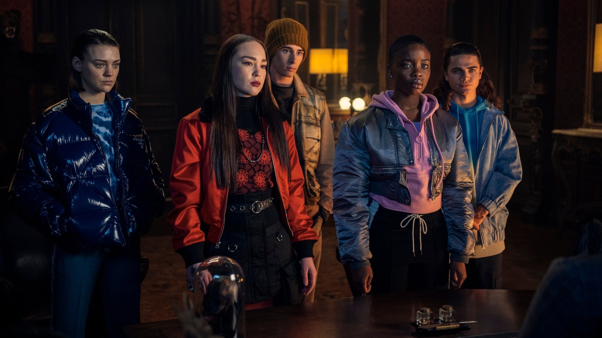 A group of teens stand together.