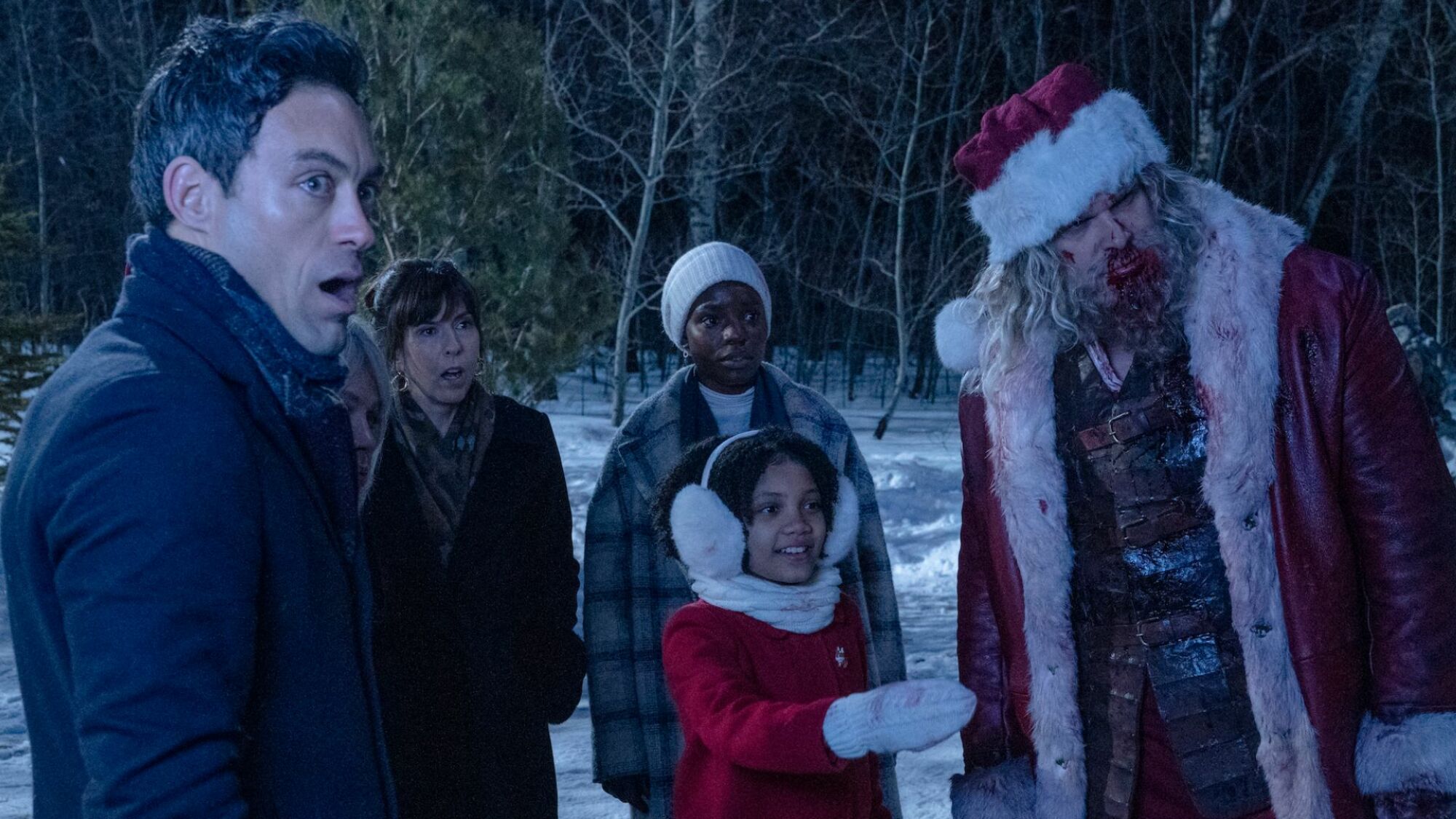 David Harbour as Santa Claus in "Violent Night" with cast members.