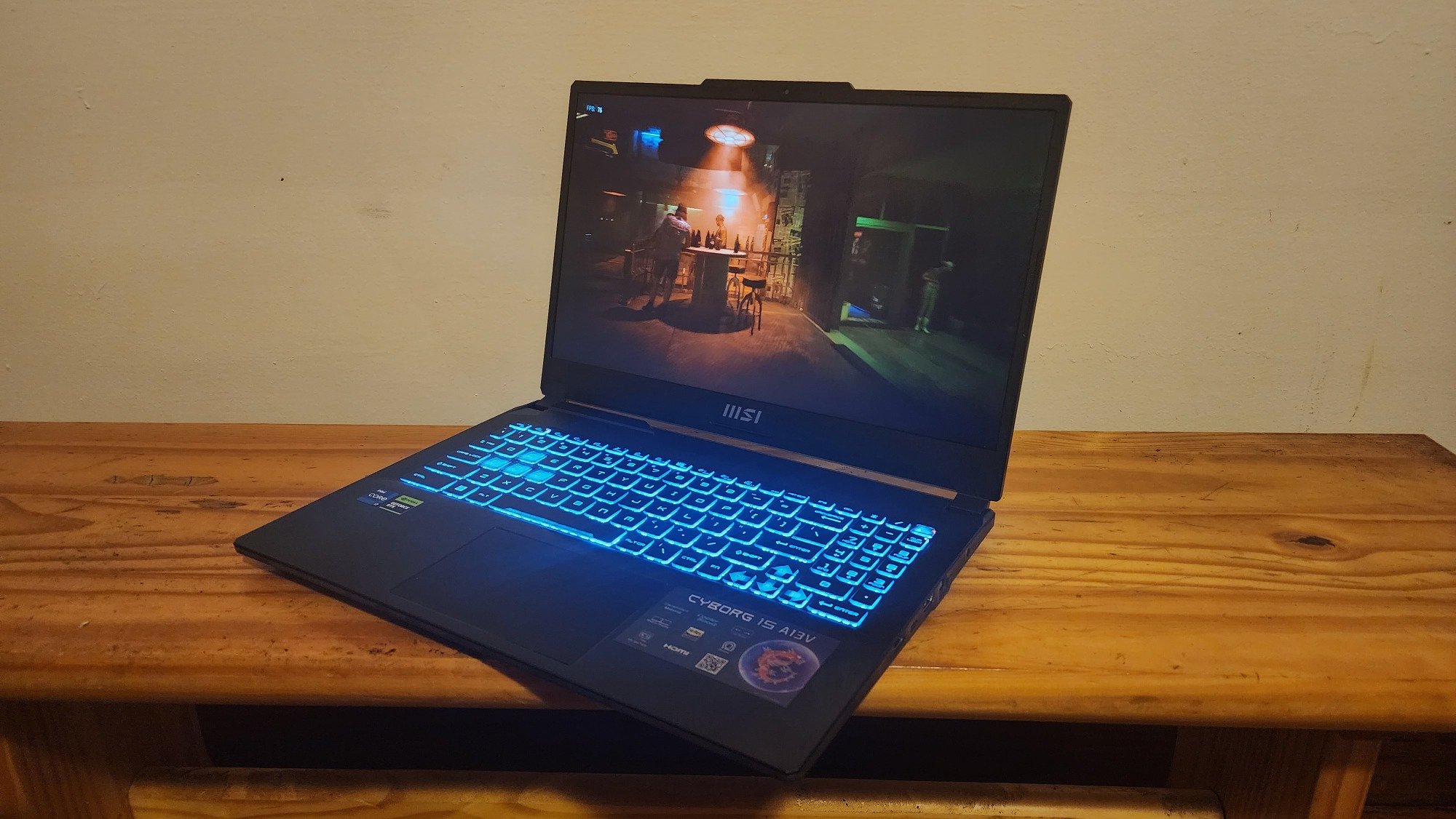 MSI Cyborg 15 on a bench playing Cyberpunk 2077