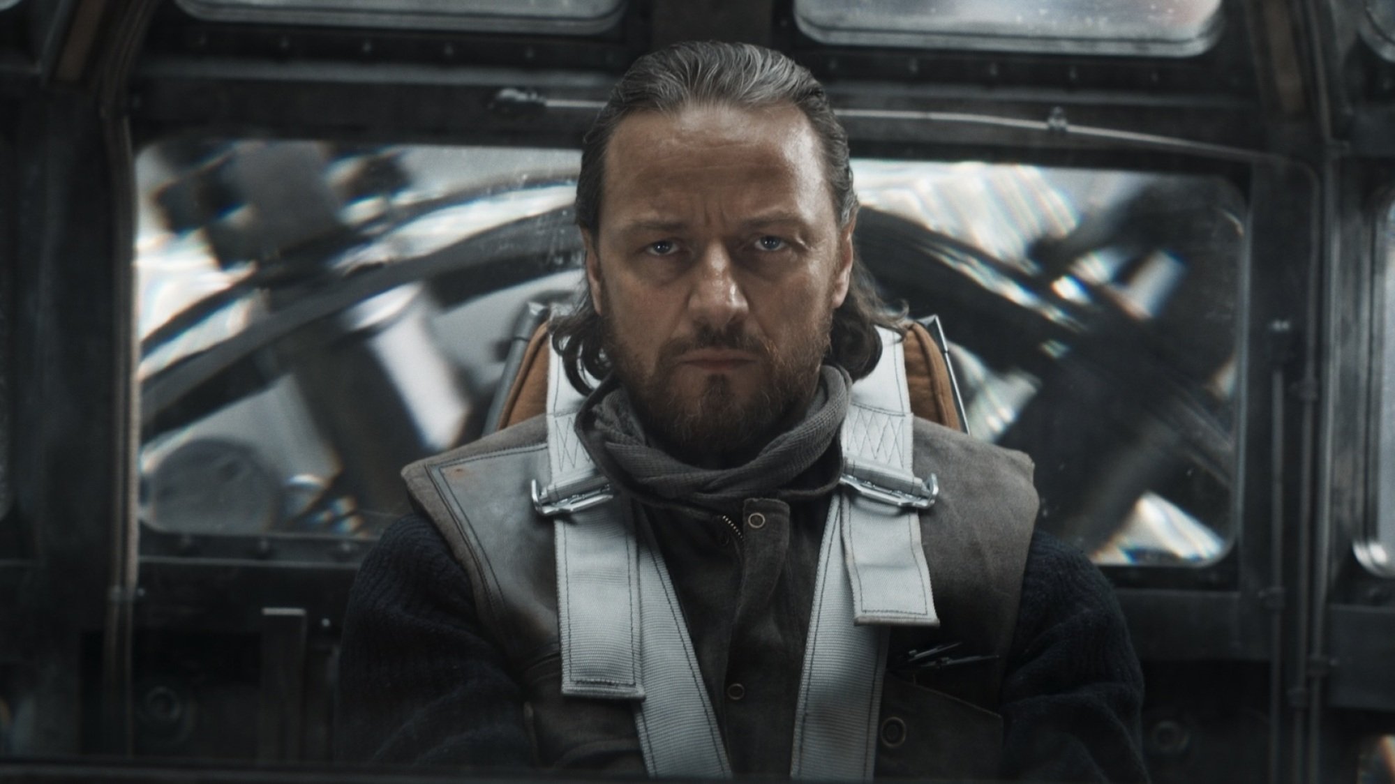 A man in a cockpit of an aircraft.