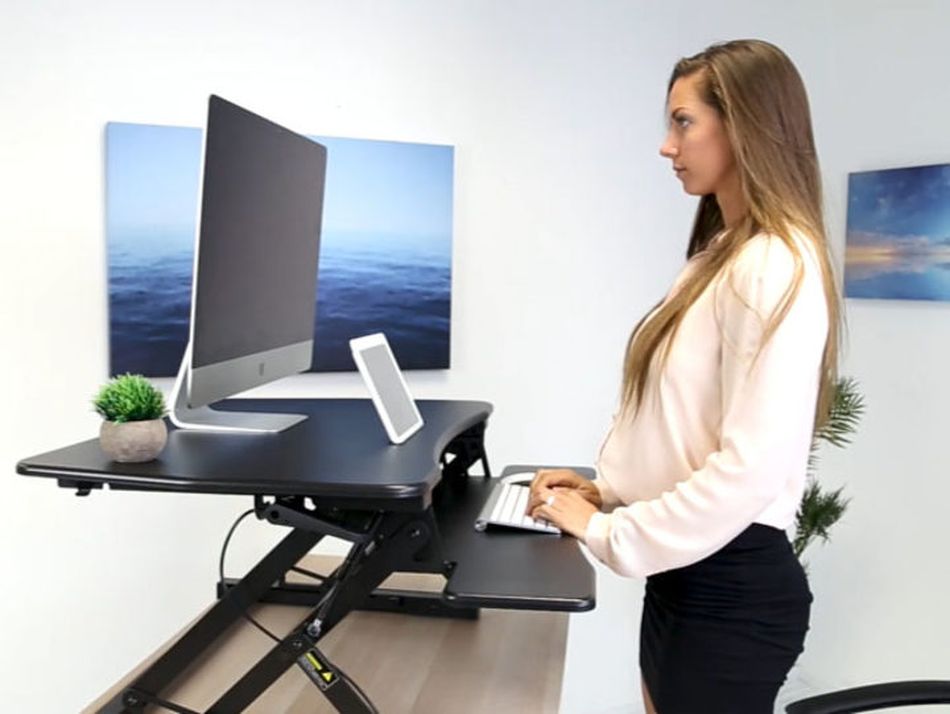Mend your mangled spine: Standing desks and laptop stands are on sale