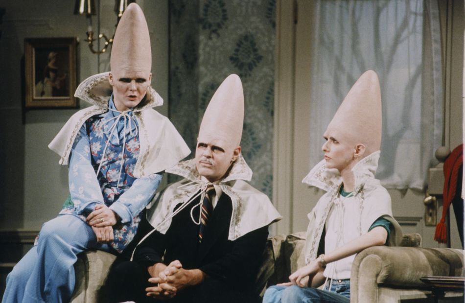 Jane Curtin, Dan Aykroyd, and Laraine Newman as Coneheads in a 1977 SNL sketch.